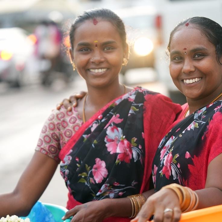 A. Chen, Lead Design Curator at HarvestGrovePasture, reviewing corporate floral arrangements